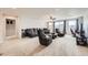 Bright and airy living room with large windows, comfortable sofa, and stylish decor at 3508 Silverado Cir, Frederick, CO 80516