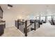 Upstairs loft showing railing, view of living space, and overhead lighting at 3508 Silverado Cir, Frederick, CO 80516