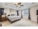 Spacious main bedroom features a tray ceiling, ceiling fan, and large windows with natural light at 3508 Silverado Cir, Frederick, CO 80516