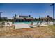 Resort-style pool with sun loungers offers a relaxing outdoor space for residents and guests on a sunny day at 3508 Silverado Cir, Frederick, CO 80516