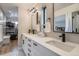 Spacious bathroom boasts a double vanity with modern fixtures and walk-in closet with custom shelving at 3911 Mariposa St, Denver, CO 80211