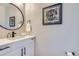 Modern powder room with a stylish mirror, vanity, and decor at 3911 Mariposa St, Denver, CO 80211