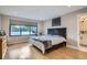Bright bedroom with large window, wood floors, and modern decor; features an in-room exercise bike at 3911 Mariposa St, Denver, CO 80211
