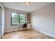 Sunlit room with wood floors, large window, desk, and decor is perfect for a bedroom or home office at 3911 Mariposa St, Denver, CO 80211