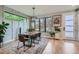 Bright dining room with modern decor, large windows, and stylish light fixture at 3911 Mariposa St, Denver, CO 80211