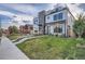 Modern two-story home featuring a rooftop terrace and landscaped front yard at 3911 Mariposa St, Denver, CO 80211