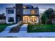Beautifully landscaped front yard leading to a modern home with a stylish entrance and rooftop deck at 3911 Mariposa St, Denver, CO 80211