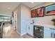Hallway includes a bar area with a sink, wine fridge, and cabinets at 3911 Mariposa St, Denver, CO 80211