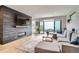 Contemporary living room featuring hardwood floors, modern fireplace, and sliding door to backyard at 3911 Mariposa St, Denver, CO 80211