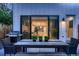 Modern backyard with outdoor dining area offering seamless flow to the home's interior at 3911 Mariposa St, Denver, CO 80211