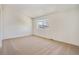 Simple bedroom with window, closet and neutral carpeting at 8402 Everett Way # B, Arvada, CO 80005