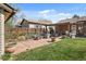Lush backyard features patio, barbecue area and lots of green space, great for relaxing or entertaining at 10769 Murray Dr, Northglenn, CO 80233