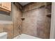 Tiled bathroom featuring a shower and tub combination at 10769 Murray Dr, Northglenn, CO 80233