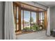 Window with plants, offering natural light and a view of the street at 10769 Murray Dr, Northglenn, CO 80233