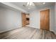 Finished bedroom featuring wood flooring, and standard closet doors at 10769 Murray Dr, Northglenn, CO 80233