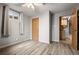 This bedroom boasts wood flooring, a window, and a ceiling fan, offering a cozy and naturally lit space at 10769 Murray Dr, Northglenn, CO 80233