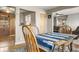 Inviting dining room features wood floors, a table with seating, and open access to the kitchen and living areas at 10769 Murray Dr, Northglenn, CO 80233