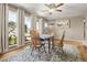 Inviting dining room with hardwood floors, large windows, and neutral paint at 10769 Murray Dr, Northglenn, CO 80233