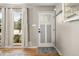 Entryway featuring hardwood floors and a door with decorative glass inserts at 10769 Murray Dr, Northglenn, CO 80233