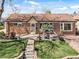 Charming brick home with a well-manicured front yard and inviting curb appeal at 10769 Murray Dr, Northglenn, CO 80233