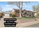 Charming brick home featuring a well-maintained front yard, mature tree and detached garage at 10769 Murray Dr, Northglenn, CO 80233