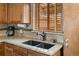 Close up of kitchen sink, featuring granite countertops and updated hardware at 10769 Murray Dr, Northglenn, CO 80233