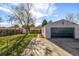 Spacious backyard view showing the garage, house, shed and grassy area at 3430 N Clayton St, Denver, CO 80205