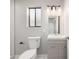 Modern bathroom with sleek vanity, decorative lighting and a frosted window at 3430 N Clayton St, Denver, CO 80205