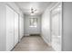 Clean bedroom with hardwood flooring, ceiling fan, closet, and adjacent bathroom at 3430 N Clayton St, Denver, CO 80205