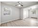 Bright bedroom with hardwood flooring, ceiling fan, and double closets for ample storage at 3430 N Clayton St, Denver, CO 80205