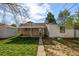 Charming front exterior features well-maintained landscaping and classic brick facade at 3430 N Clayton St, Denver, CO 80205
