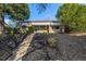 Charming single-story brick home featuring well-maintained landscaping and inviting curb appeal at 3430 N Clayton St, Denver, CO 80205