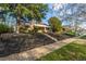 Inviting single-story brick home featuring a well-manicured lawn and charming curb appeal at 3430 N Clayton St, Denver, CO 80205