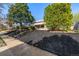 Attractive single-story brick home with neat landscaping and lush trees, set back from the street at 3430 N Clayton St, Denver, CO 80205