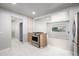 The kitchen boasts stainless steel appliances and bright, open access to other rooms at 3430 N Clayton St, Denver, CO 80205