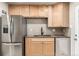 This kitchen has stainless steel appliances, granite countertops, and light wood cabinets at 3430 N Clayton St, Denver, CO 80205