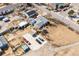 Aerial view showcasing the property layout with horse stalls, sheds, and a trampoline at 1930 Altura Blvd, Aurora, CO 80011