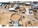 Aerial view highlighting the horse facilities, including stalls and an arena at 1930 Altura Blvd, Aurora, CO 80011