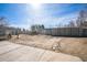 Spacious backyard features a large paddock, multiple stalls, and ample room for outdoor activities at 1930 Altura Blvd, Aurora, CO 80011