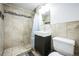 Modern bathroom featuring an integrated sink and shower with neutral tile at 1930 Altura Blvd, Aurora, CO 80011