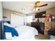 Bedroom featuring carpet flooring and a ceiling fan at 1930 Altura Blvd, Aurora, CO 80011