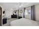 Spacious bedroom with carpet flooring, a ceiling fan, and ample natural light at 1930 Altura Blvd, Aurora, CO 80011
