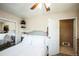 Bedroom featuring carpet flooring, a ceiling fan, and a view of the exterior at 1930 Altura Blvd, Aurora, CO 80011