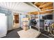 Covered patio featuring a laundry area and additional storage at 1930 Altura Blvd, Aurora, CO 80011