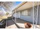 Inviting covered front porch with space for seating, offering a cozy outdoor space at 1930 Altura Blvd, Aurora, CO 80011