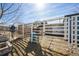 Outside horse stall with metal fencing, metal water trough, and horse at 1930 Altura Blvd, Aurora, CO 80011