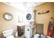 Convenient laundry room and half bath combination, with stacked washer and dryer at 1930 Altura Blvd, Aurora, CO 80011