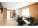 Comfortable living room area featuring tile flooring, a sofa and natural light at 1930 Altura Blvd, Aurora, CO 80011