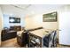 Relaxing living room with a large TV, sofa, and direct access to the outside at 1930 Altura Blvd, Aurora, CO 80011