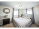 Bright main bedroom with large windows, a ceiling fan, and neutral tones at 1930 Altura Blvd, Aurora, CO 80011